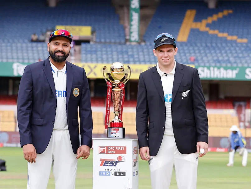 Tom Latham with Rohit Sharma after the match.