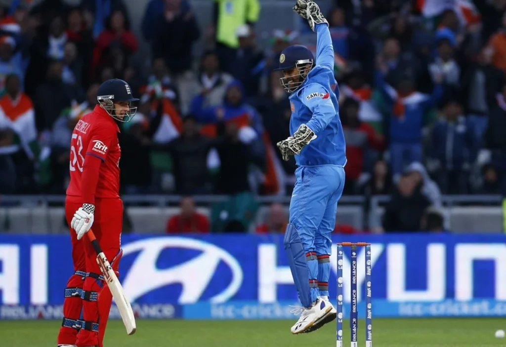 MS Dhoni celebrates after James Tredwell misses the last ball of the innings.