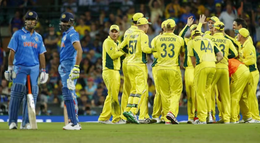 Australian players celebrating after dismissing Ravindra Jadeja for 16 runs off 17 balls.