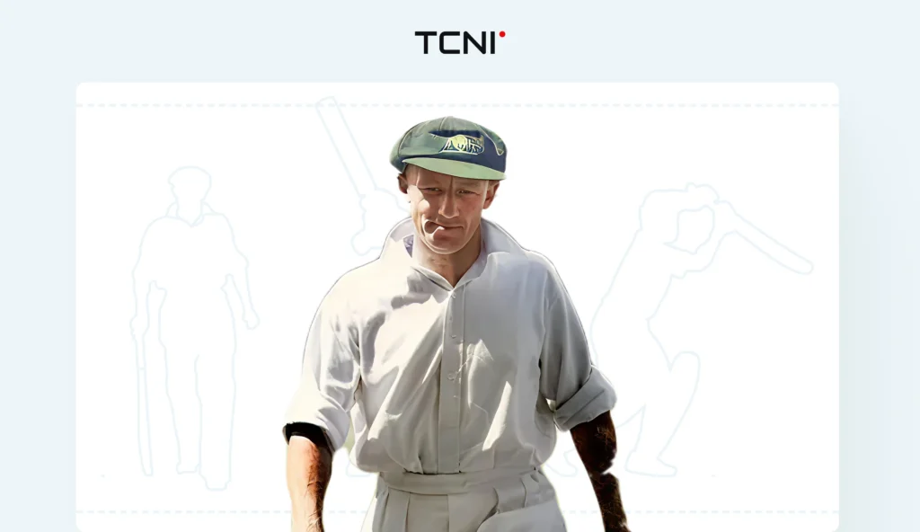 Don Bradman holding a Trophy.