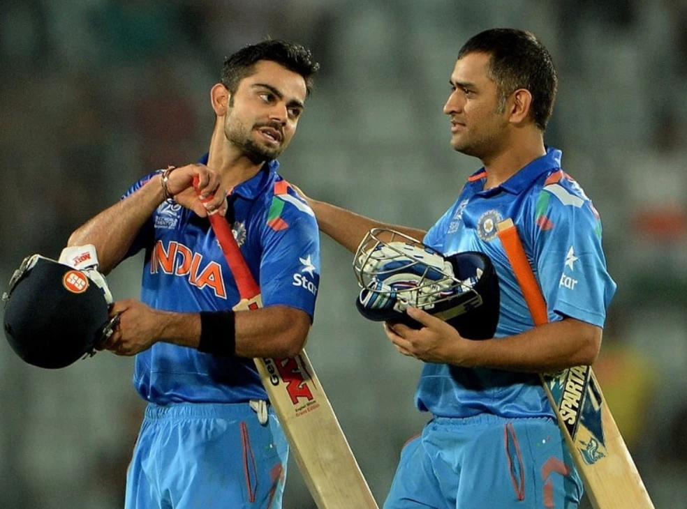 Virat Kohli and MS Dhoni celebrate after winning the 2014 T20 World Cup Semi-Finals against South Africa.