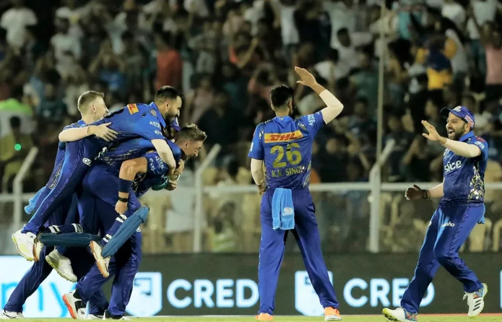 Mumbai Indians celebrate after defeating Gujarat Titans by 5 Runs.