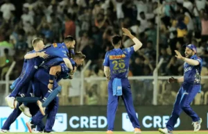 Mumbai Indians celebrate after defeating Gujarat Titans by 5 Runs.