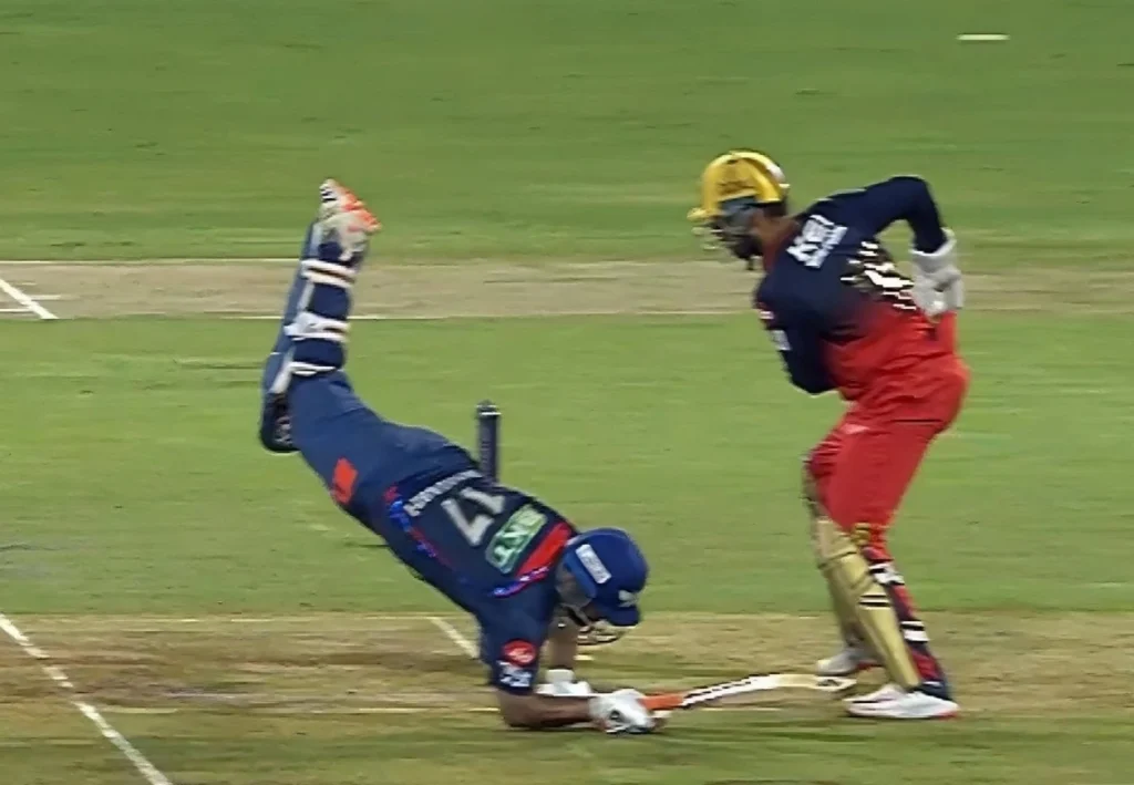 Rishabh Pant falls while attempting a wide delivery.