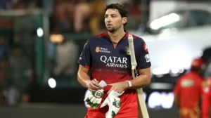 Tim David amused fans by sliding on covers during a rain delay at Chinnaswamy.