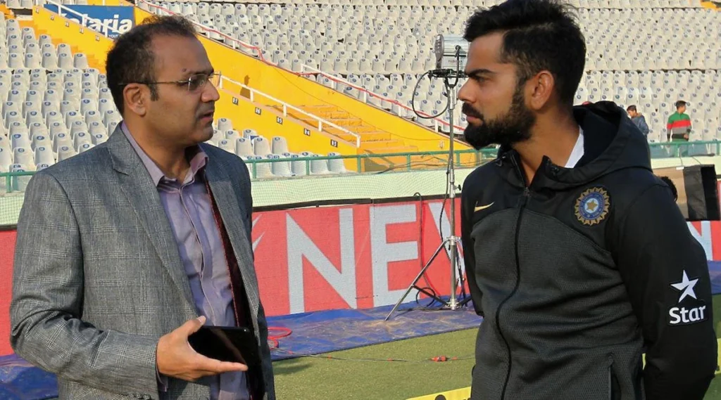 Virat Kohli and Virender Sehwag talking about the game.