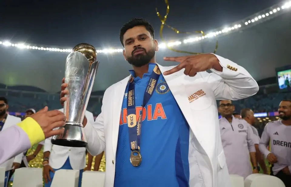 Shreyas Iyer holds the 2025 Champions Trophy.