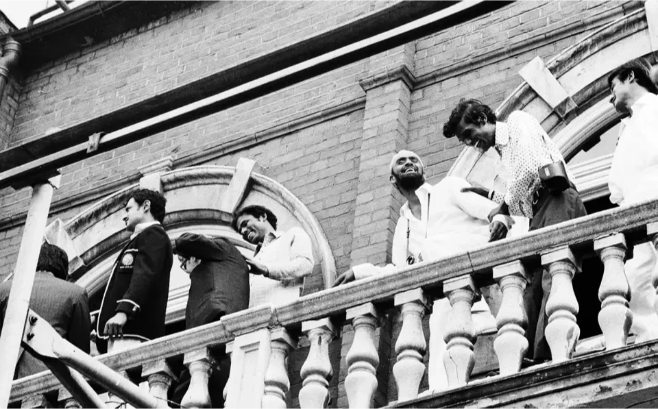 India's players celebrate on the balcony.