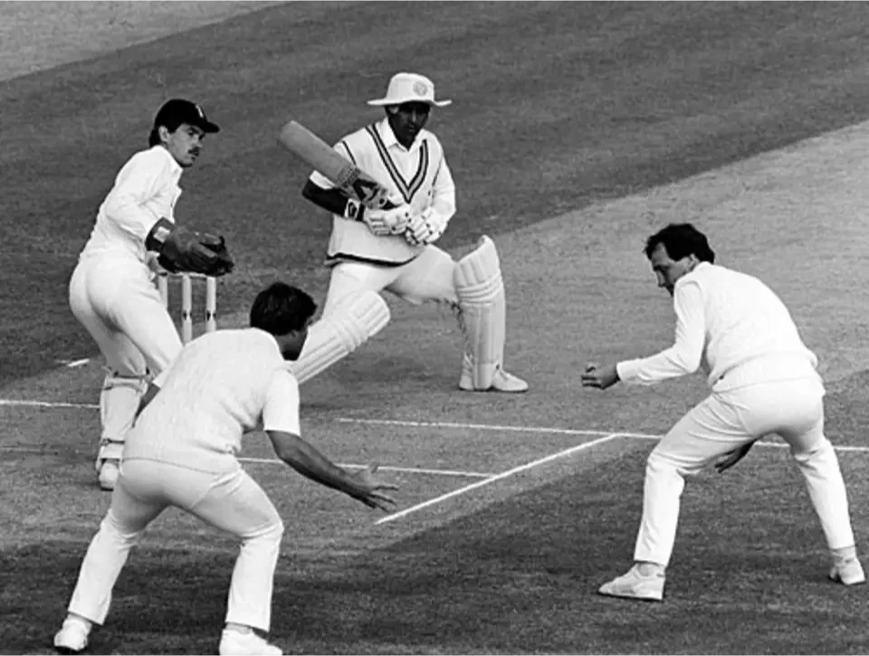 Sunil Gavaskar watches the ball fly past the fielders.