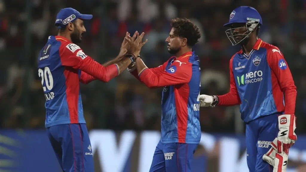 Axar Patel, Kuldeep Yadav and Abishek Porel on the field.