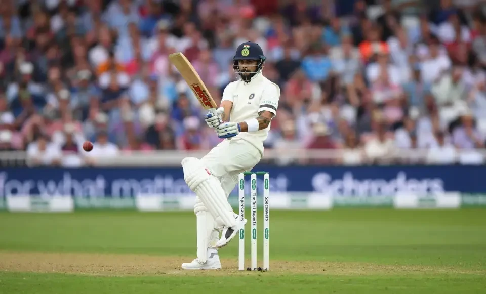 Virat Kohli turns to hit the ball.