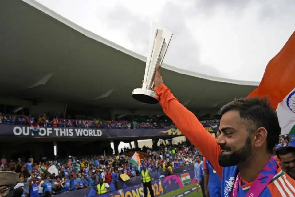 Virat Kohli holds the T20 World Cup trophy.