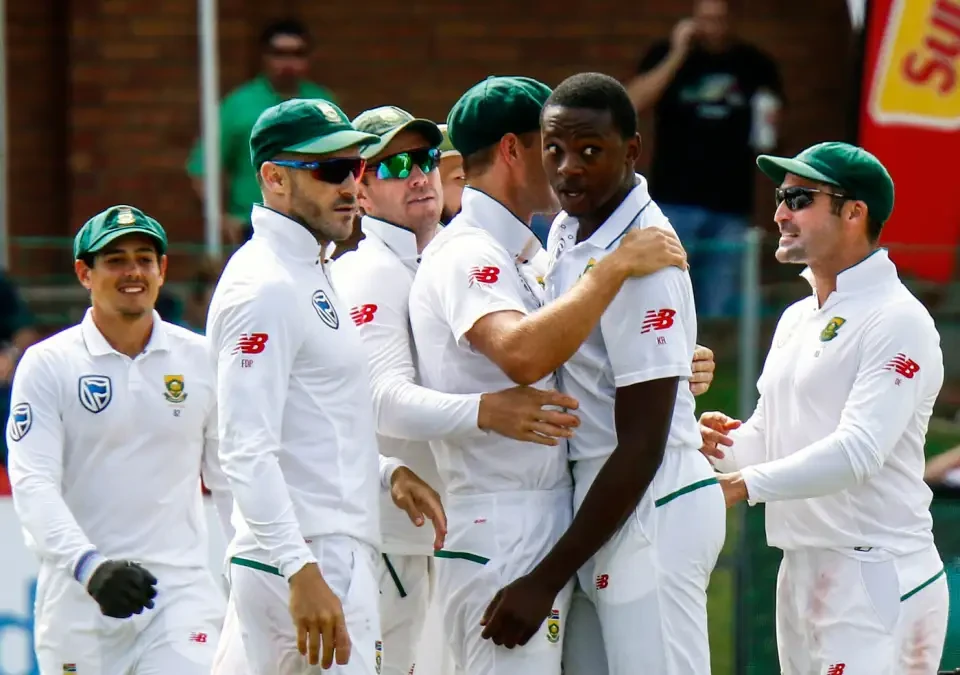 South African players calming down Kagiso Rabada.