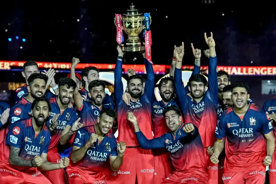Virat Kohli celebrates RCB's IPL win with his team.