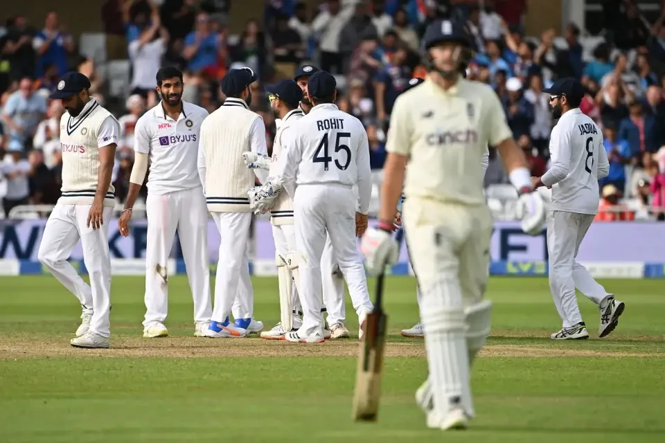 Jasprit Bumrah joins his team mates in celebration.