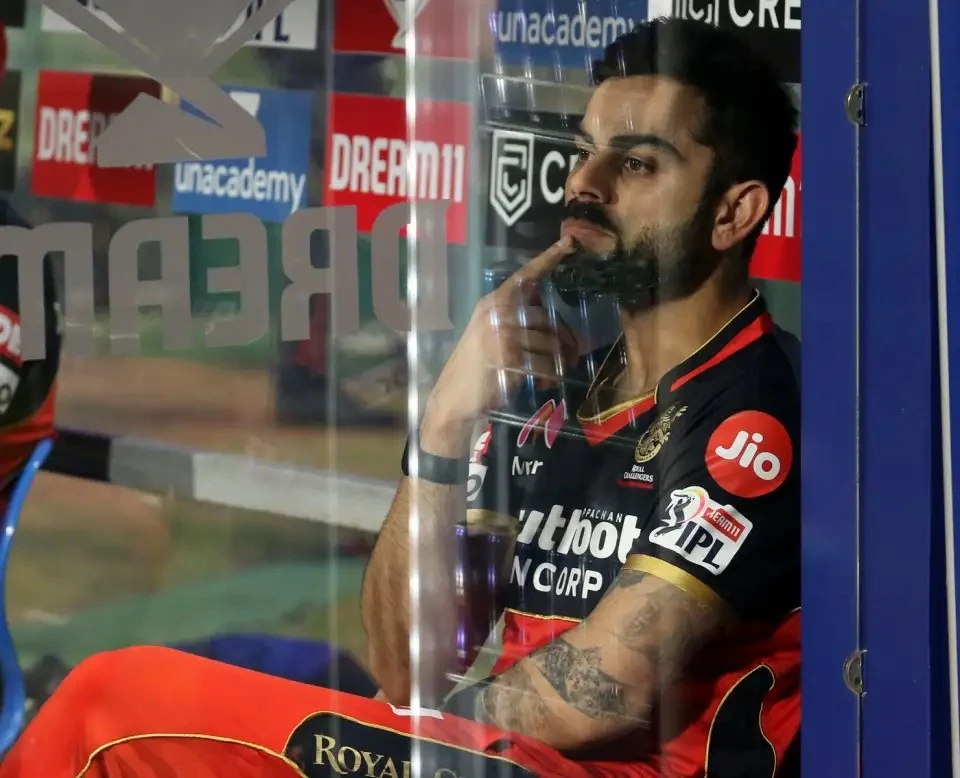 Virat Kohli watching RCB's batting collapse.