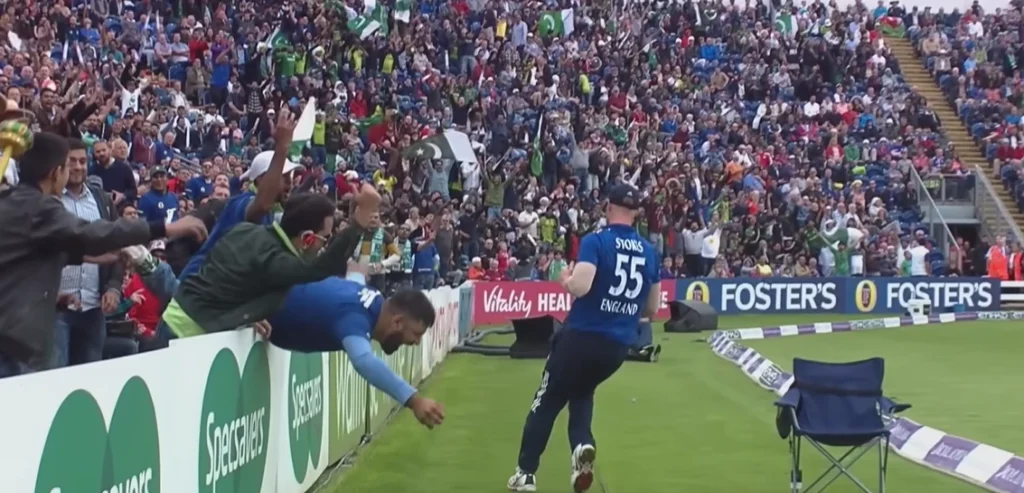 Fan takes a stunning catch in the crowd.