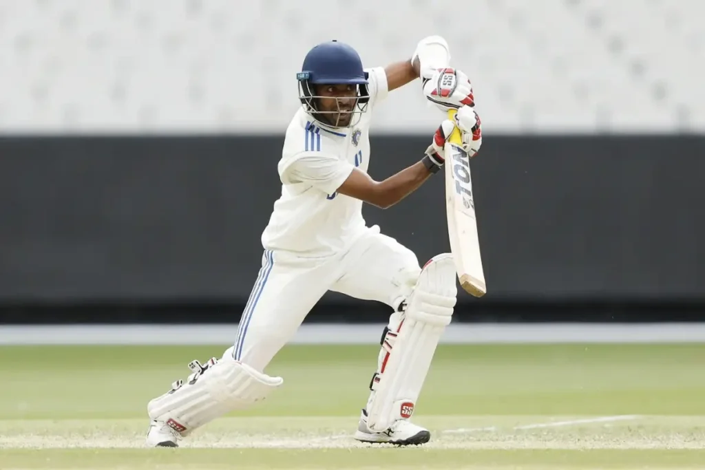 Abhimanyu Easwaran is kicking the ball.