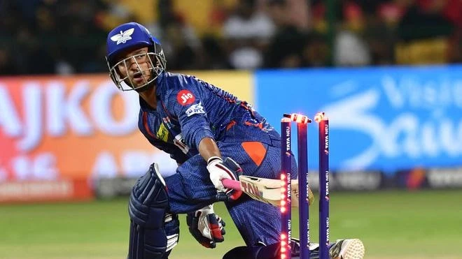 Ayush Badoni smashes a six as his bat hits the stumps.