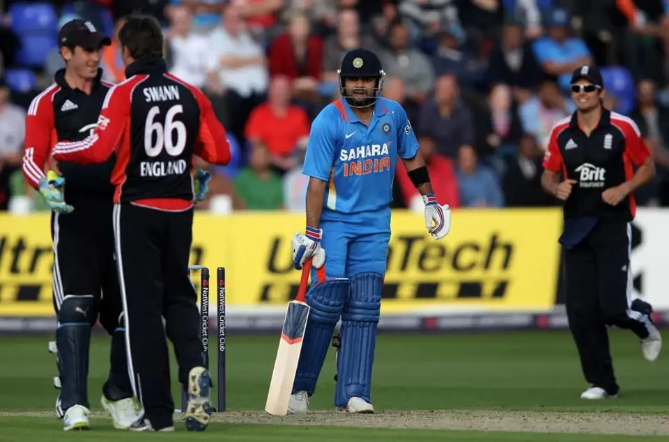 England celebrating as Kohli loses his wicket via hit wicket.