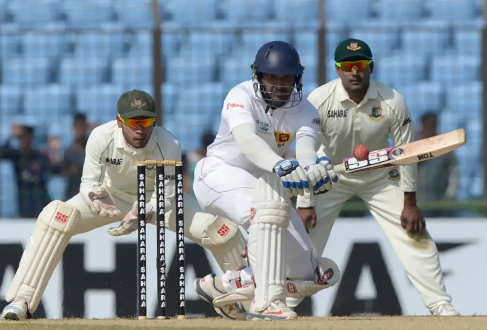 Kumar Sangakkara plays a sweep shot.