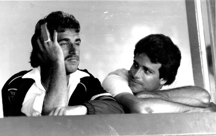 Wayne Phillips with his teammates in the dugout.