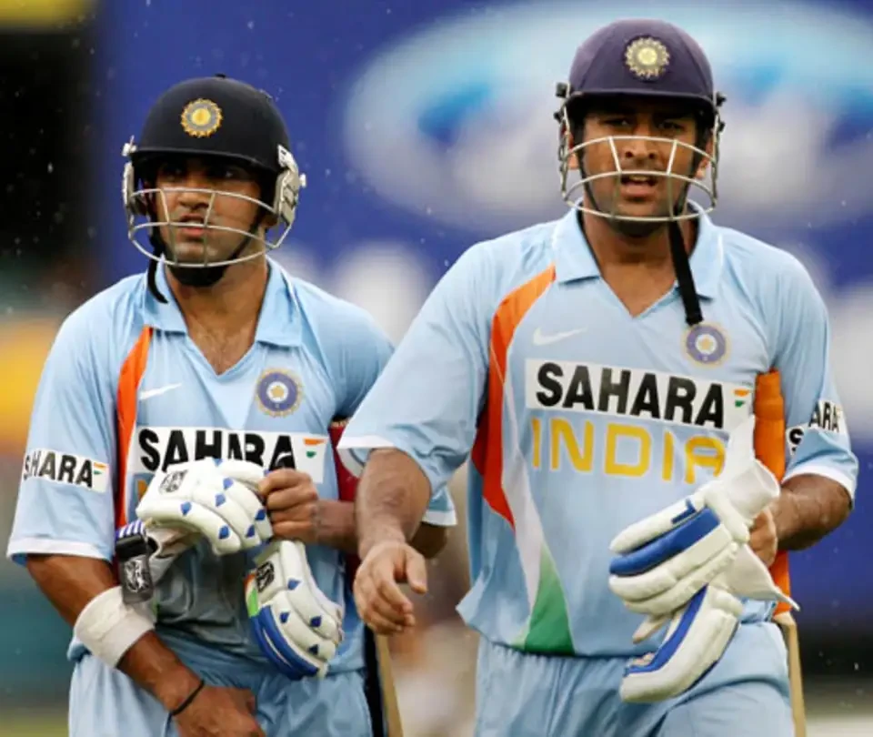 MS Dhoni and Gautam Gambhir walking off after an unbeaten partnership.