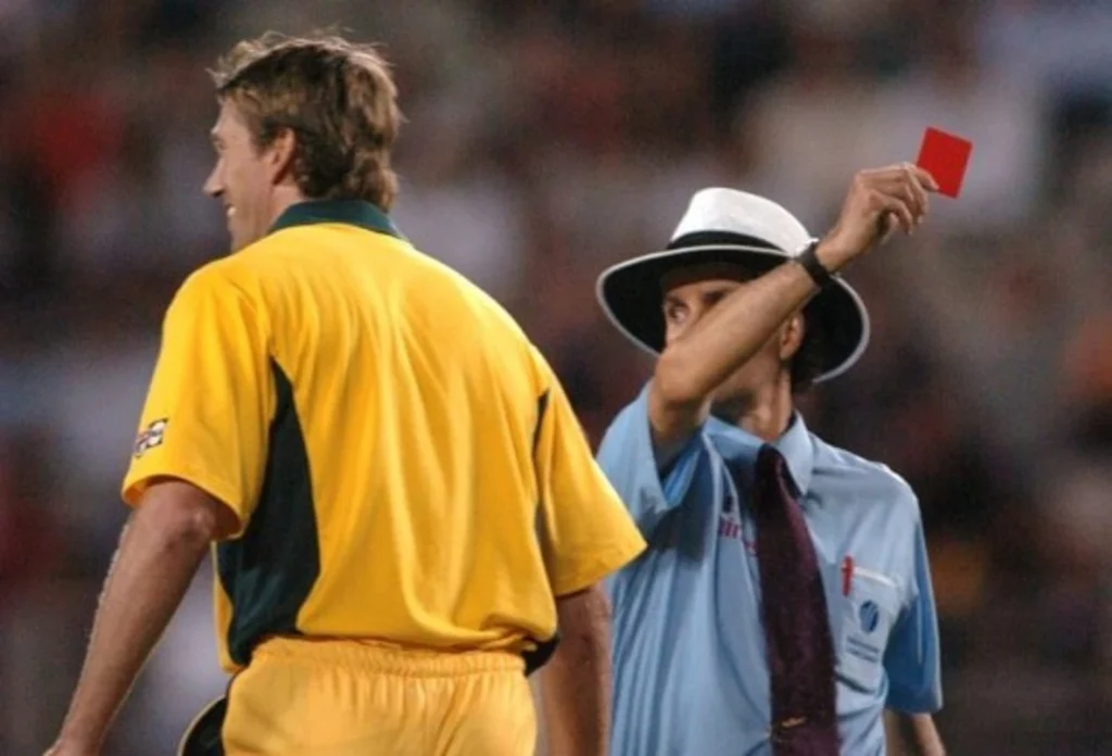 Billy Bowden pulls a red card.