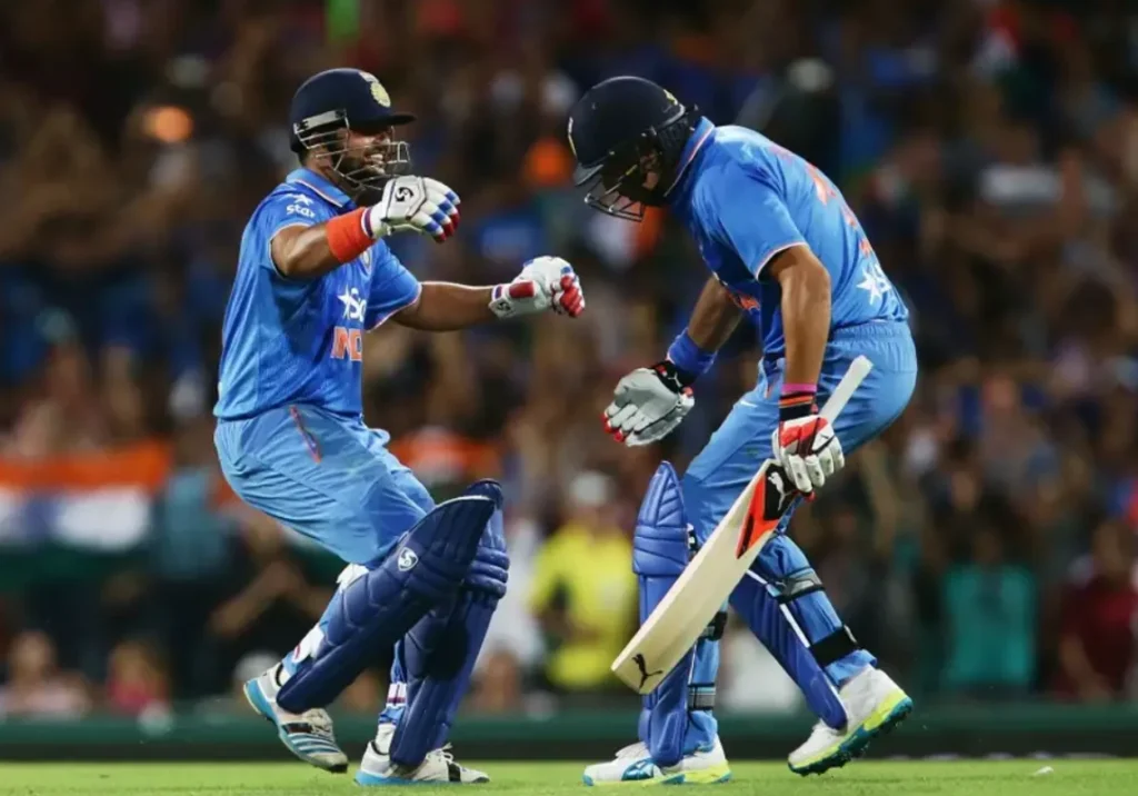 Yuvraj Singh and Suresh Raina celebrate after winning over Australia.
