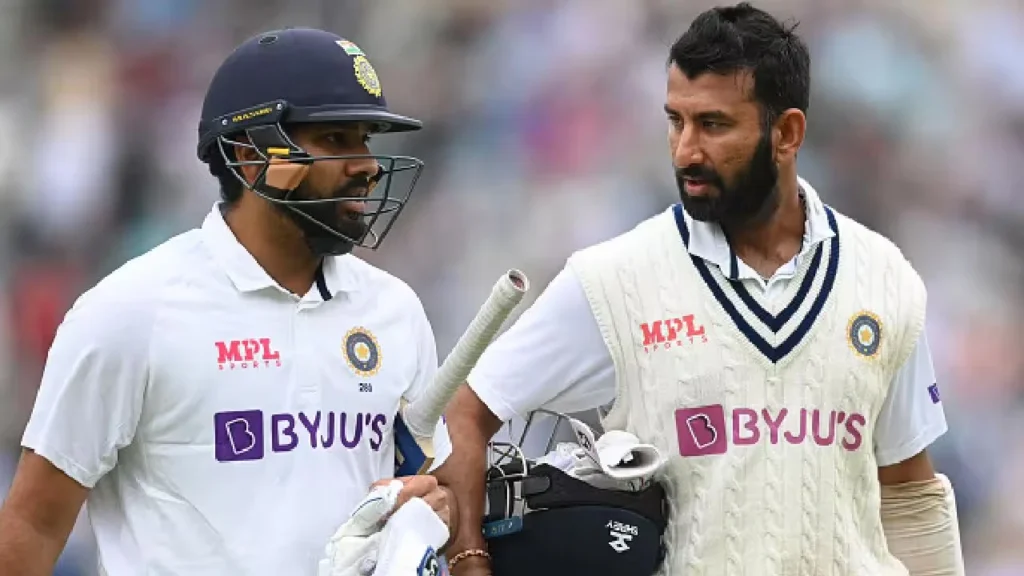 Rohit Sharma and Cheteshwar Pujara are having a chat.