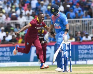 Dwayne Bravo celebrates after dismissing Virat Kohli for 16 runs.