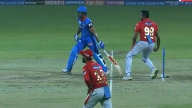 Ravichandran Ashwin and Shikhar Dhawan in action on the field.