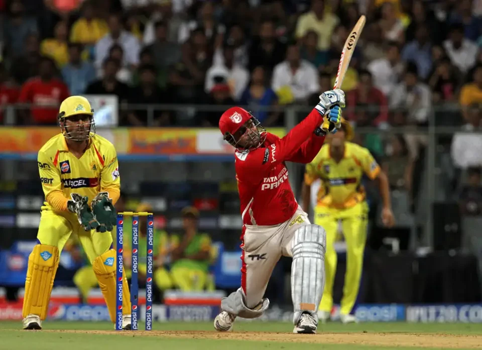 Virender Sehwag hits the ball on the ground.