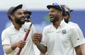 Virat Kohli and Shikhar Dhawan celebrate after India's defeat of Sri Lanka.