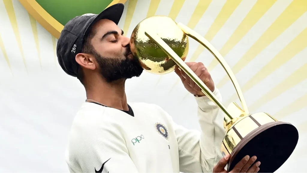Virat Kohli with the BGT Trophy.