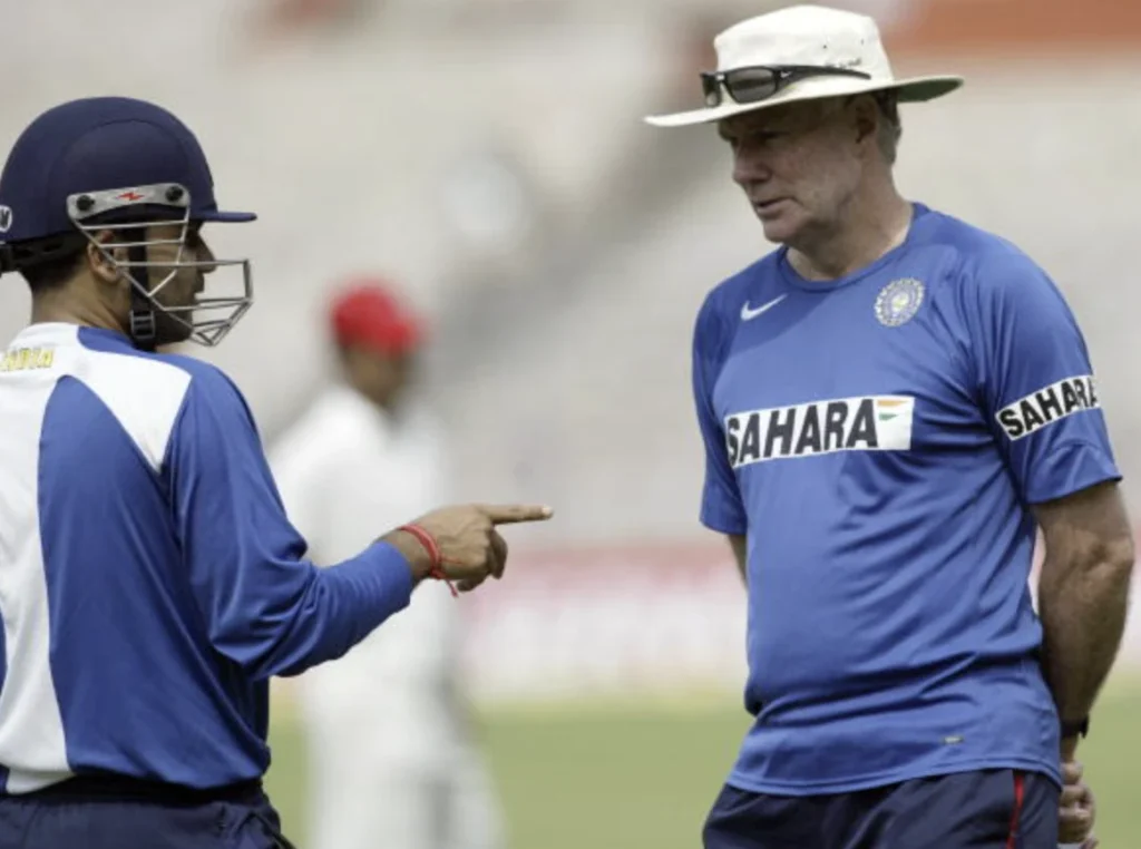 Virender Sehwag and Greg Chappell having a discussion.
