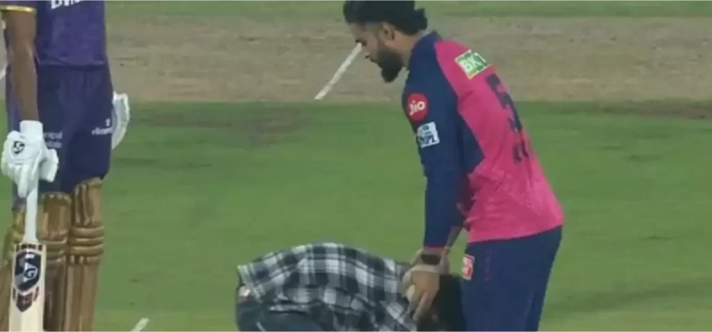 Fan breaches security to touch Riyan Parag’s feet.