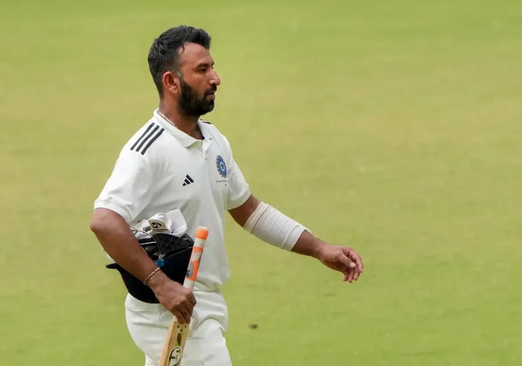 Cheteshwar Pujara leaves the field.