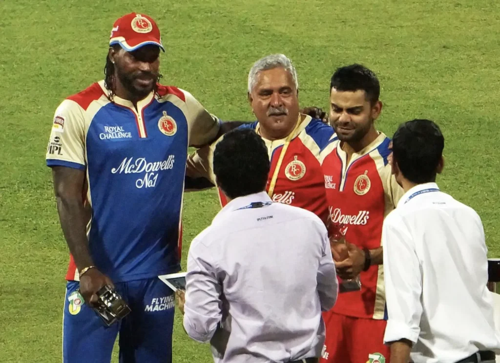 Chris Gayle and Virat Kohli with Vijay Mallya.