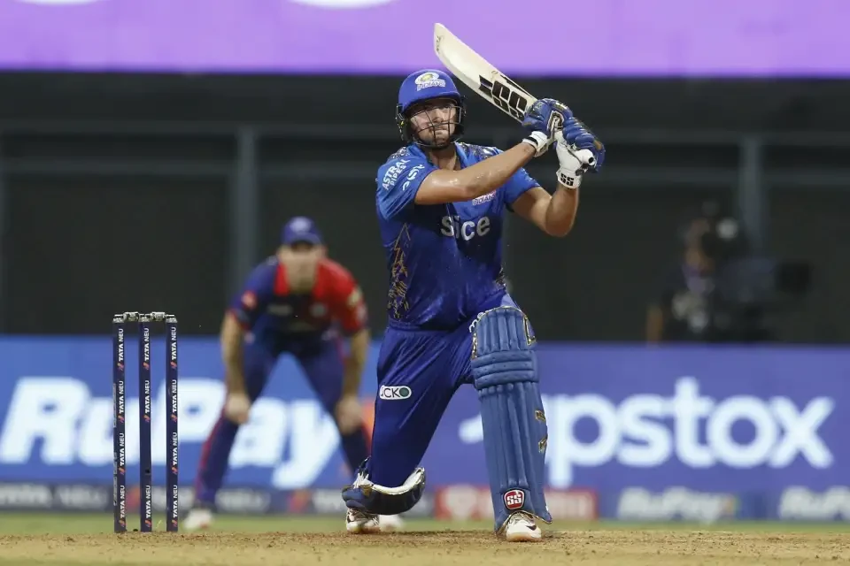 Tim David smashes the ball fine for a six.
