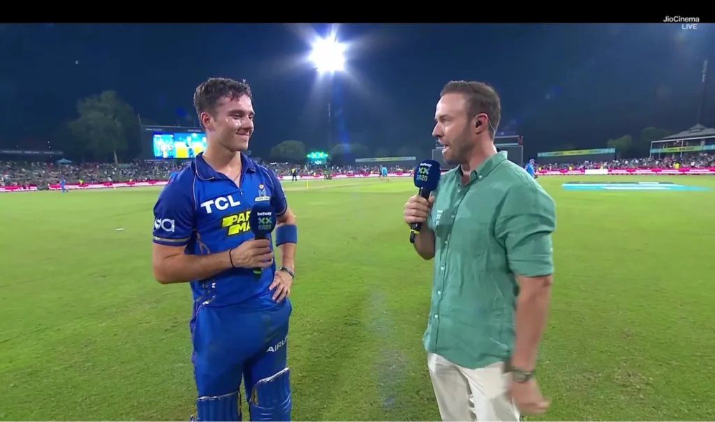 AB de Villiers and Dewald Brevis are having a chat.