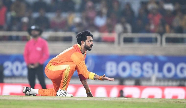 Sreesanth attempts to stop the ball.