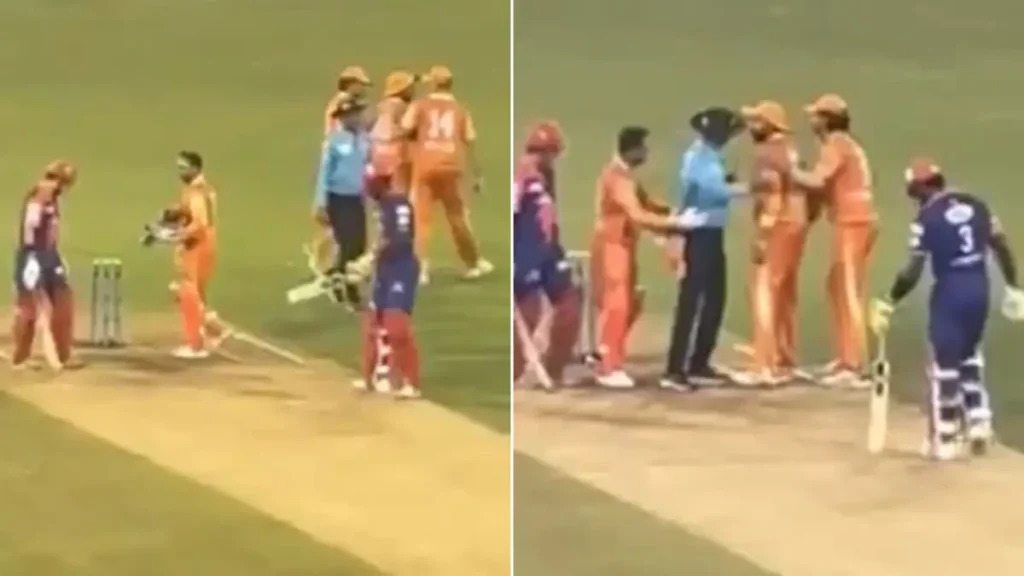 Players and umpires are separating Gambhir and Sreesanth.