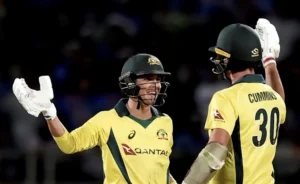 Pat Cummins and Jhye Richardson celebrate after winning the match.