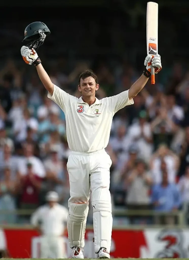 Adam Gilchrist celebrates his century in just 57 balls.