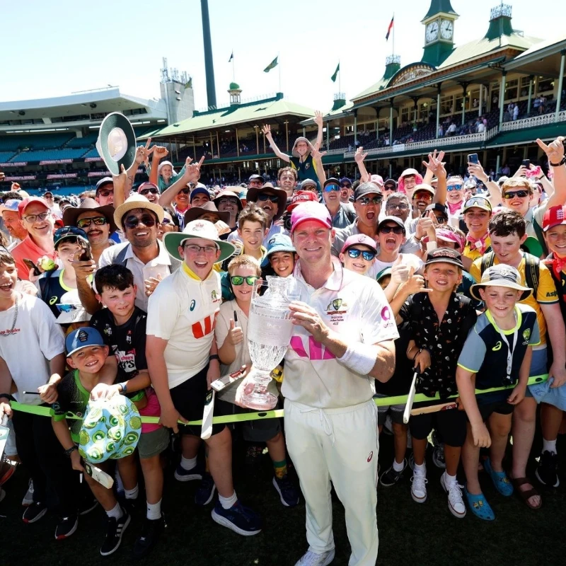Captain Steve Smith clicks a picture with fans post victory.